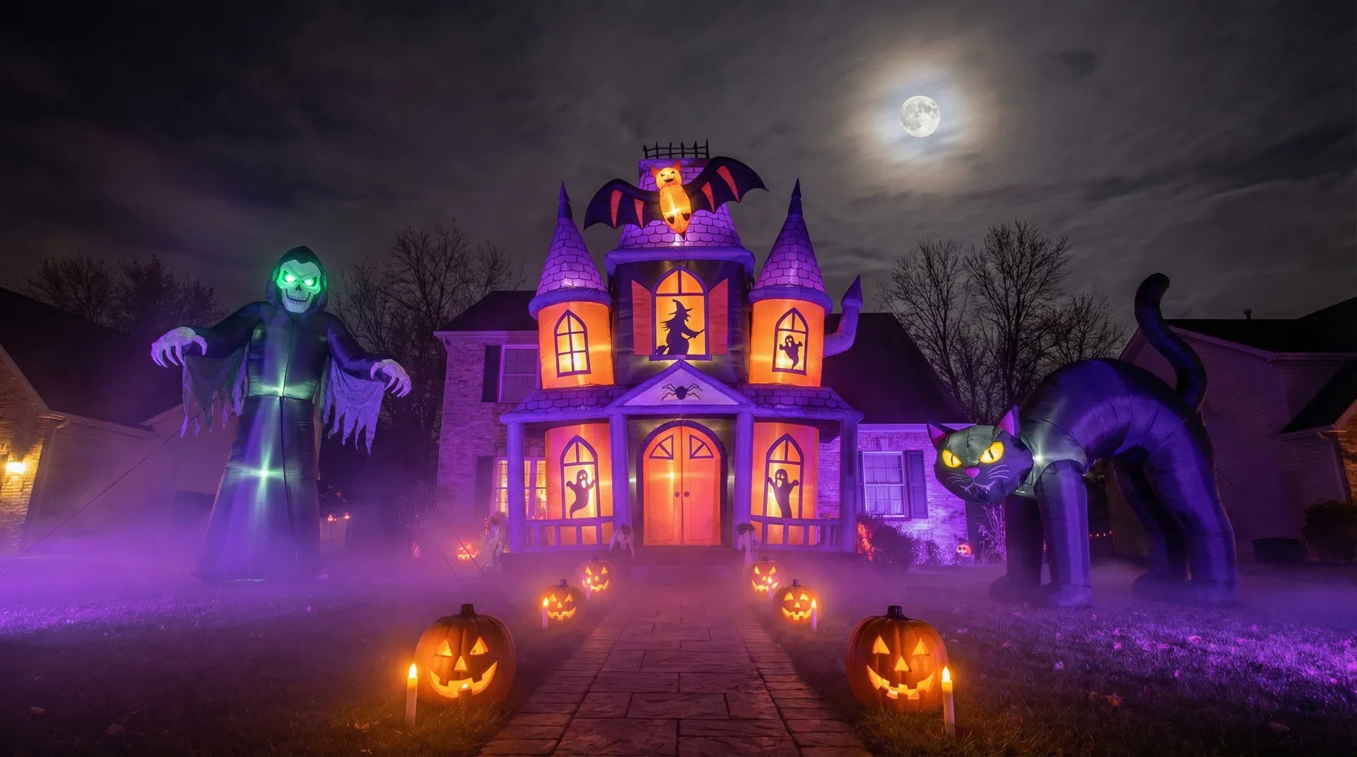 Halloween inflatables in a spooky yard